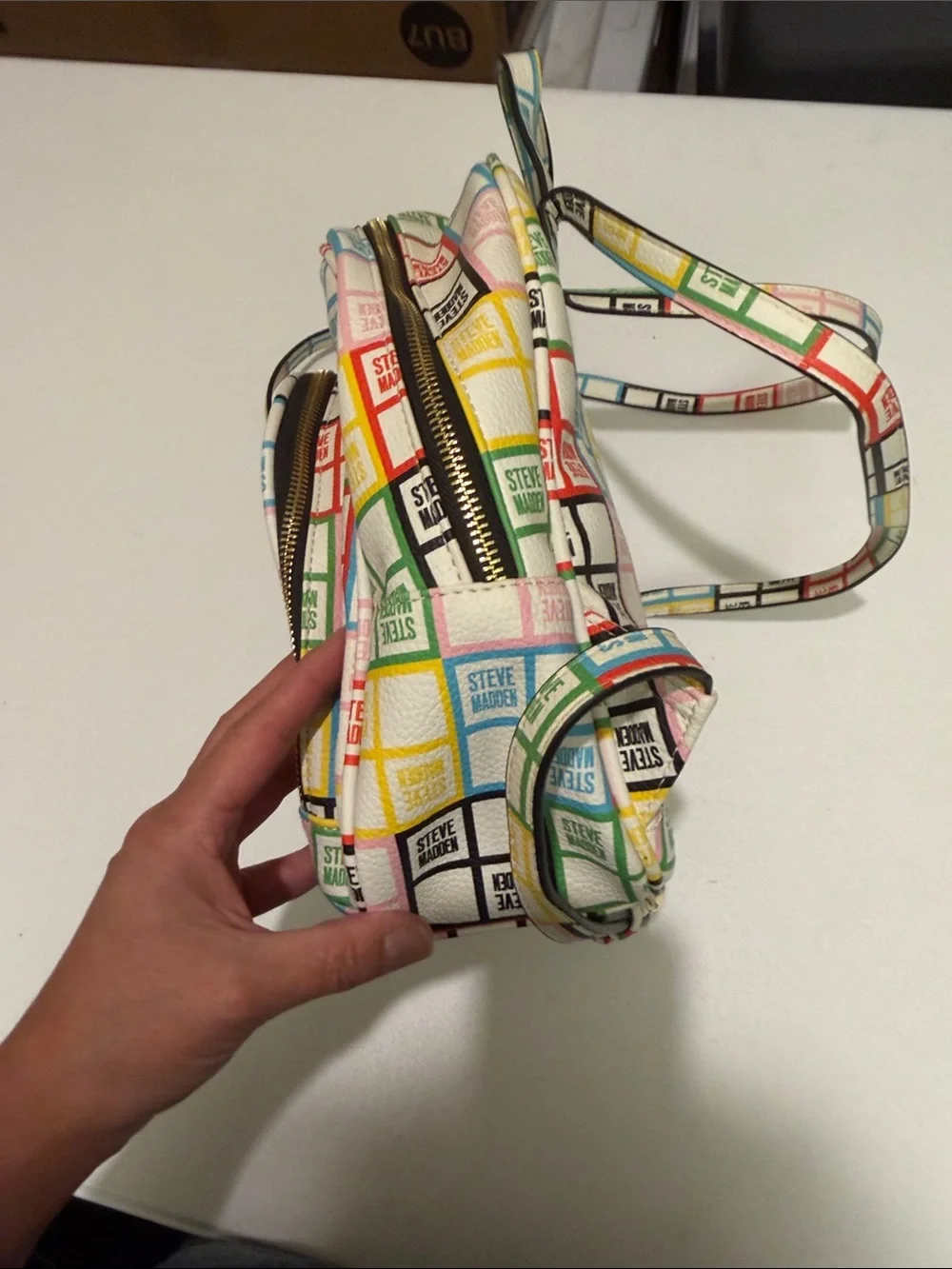 Steve Madden White Mini Backpack with Multicolor Logo Grid